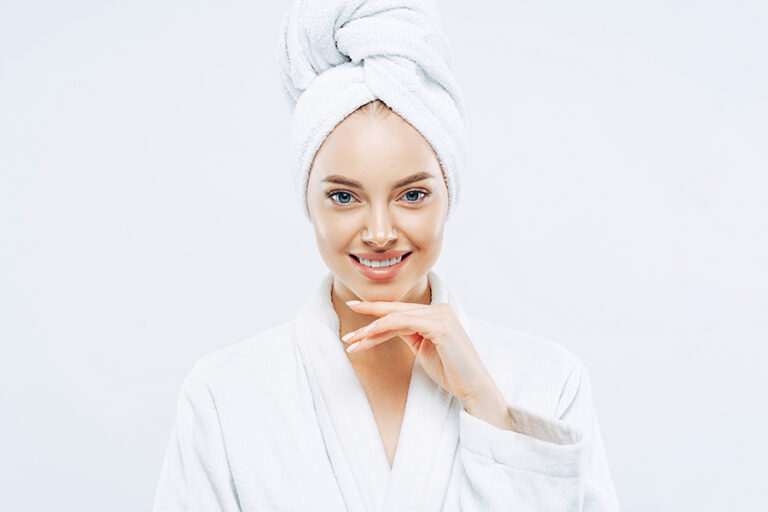 Beautiful Woman In Bathrobe With Clear Healthy Skin