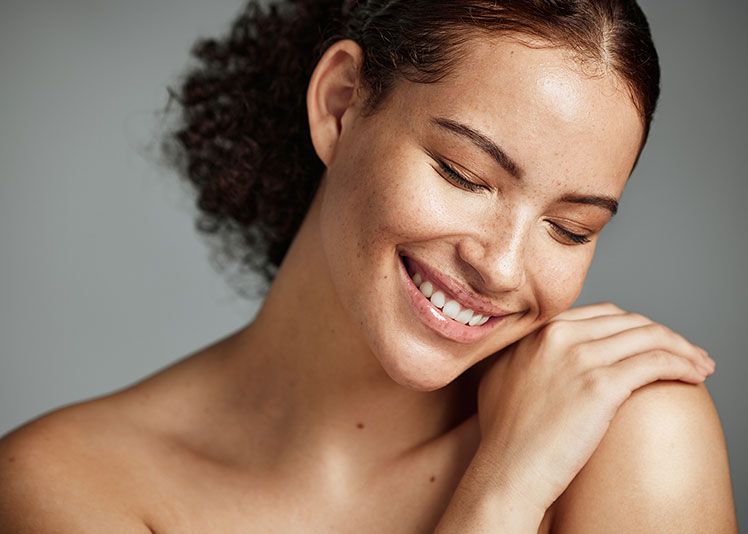 Facial &Amp; Beauty Treatments 23 Face, Beauty And Skin With A Model Black Woman In Studio On A Gray Background To Promote Natural Care. Facial, Wellness And Makeup With An Attractive Young Female Happy With Her Skincare Product