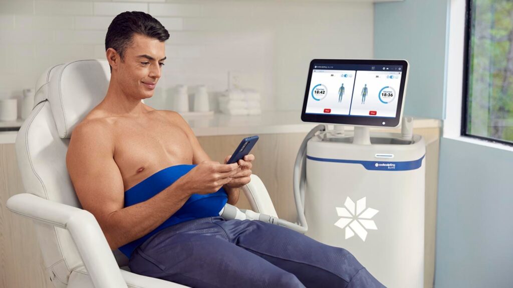 Man Receiving Coolsculpting Treatment To Reduce Stubborn Abdominal Fat Using Non-Surgical Body Contouring Technology.