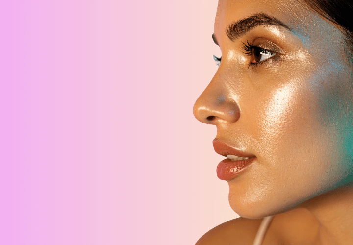 Close-Up Side Profile Of A Woman With Glowing, Radiant Skin Against A Soft Gradient Background, Highlighting Smooth Texture And Natural Luminosity