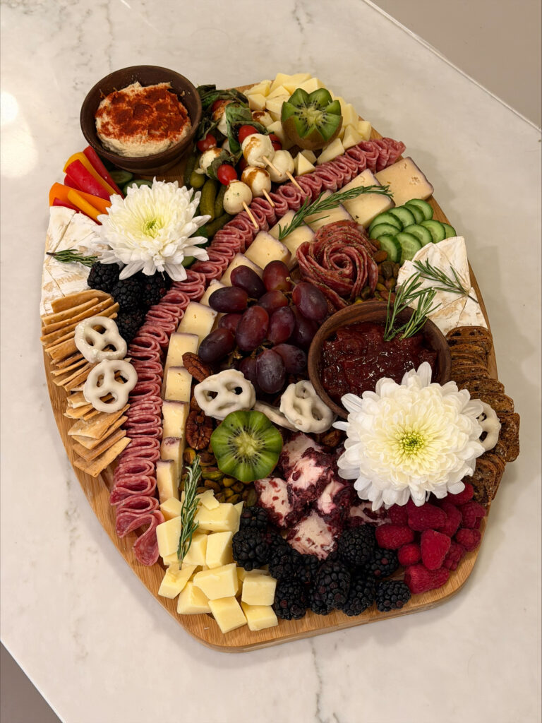 Colorful Charcuterie Board With Flowers At Spa Parties.