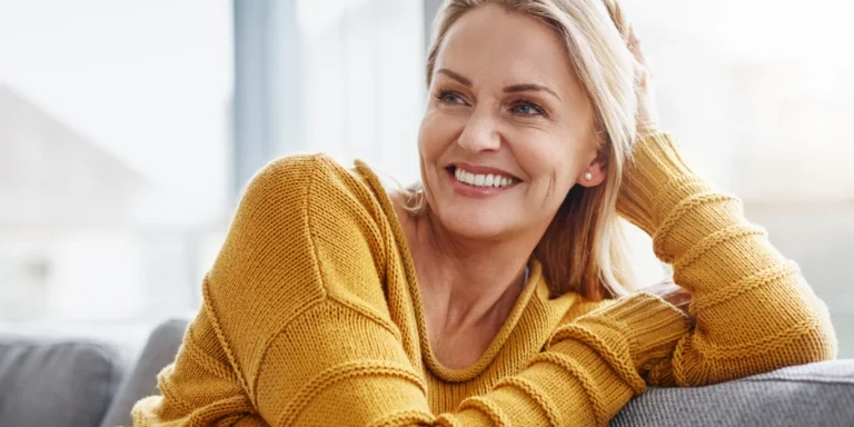 Attractive Mature Woman Relaxing On The Sofa